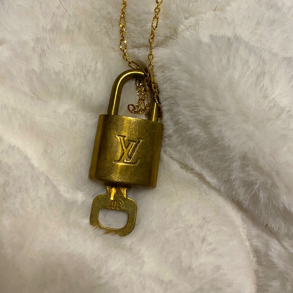 LOUIS VUITTON lock on a chain
